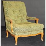 A 19th Century Continental walnut framed salon open armchair on cabriole legs with green foliate