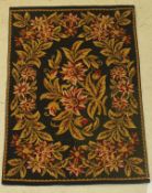 An English needle pattern panel, depicting floral sprays of green,