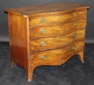 A George III serpentine fronted mahogany chest of four graduated drawers,