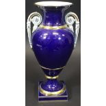 A late 19th/early 20th Century Meissen Bleu Royale and gilt decorated vase of baluster urn form,