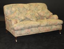 A Derwent floral upholstered two seat sofa in the Howard manner,