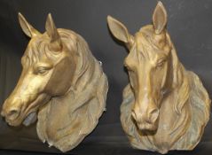 A pair of 19th Century French zinc gold painted equine advertising signs in the form of horse's