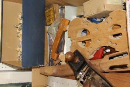 A box containing various violin and guitar making tools including saws, chisels, spares, etc,