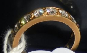 A gold mounted 17 stone diamond eternity ring, approx 1.
