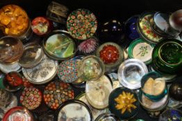 A collection of paperweights to include millefiori paperweights,