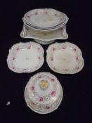 A Bloor Derby rose and gilt decorated part dinner service comprising fifteen plates,