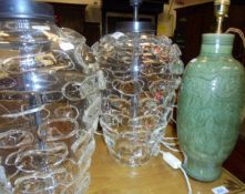 A pair of modern glass table lamps decorated with textured pebble effect and a modern celadon