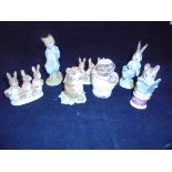 A collection of Beswick Beatrix Potter figurines to include "Foxy Whiskered Gentleman", "Flopsy,