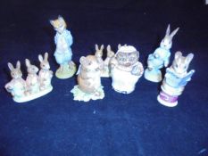 A collection of Beswick Beatrix Potter figurines to include "Foxy Whiskered Gentleman", "Flopsy,