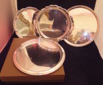 Three Christofle of Paris trays, one electr-plated, the other two with glass bases,