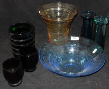 A selection of coloured glassware to include balls, vases,