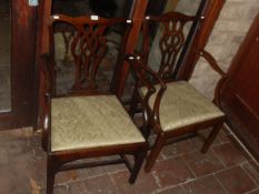 Two late 18th Century Provincial Chippendale mahogany framed carver chairs (arms added later) with