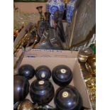 Three brass fireside companion tools, four barley-twist oak candlesticks, a set of wooden boules,