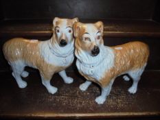 Two Staffordshire figures of dogs standing upon all fours