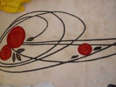 A modern rug, the plain ground decorated with Rene Mackintosh style floral spray,