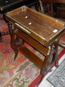 A French empire style mahogany plant stand, the plain top with brass detail to lyre shaped supports,