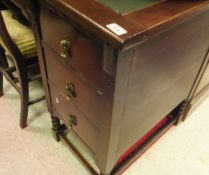 A 20th Century mahogany desk with green inset top with seven assorted drawers on bobbin turned