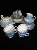 A Wedgwood turquoise "Florentine" pattern part tea service comprising teapot, cream jug, sugar bowl,
