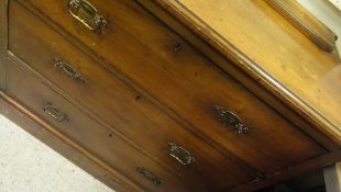 An Edwardian satinwood chest of three drawers on a plinth base