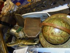 A box containing assorted sundry items to include a globe, a pair of brass horse andirons,