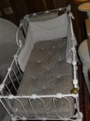 A Victorian white painted iron cot