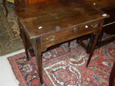 A 19th Century oak single drawer side table on turned tapering legs