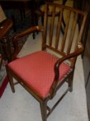 A set of seven (6+1) 19th Century mahogany framed slat back dining chairs with drop in seats,