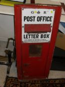 A GR Post Office letter box door painted red bearing white enamel sign marked "GR Post Office