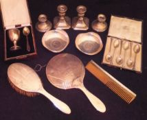 A collection of silver wares to include a cased set of six teaspoons, two ashtrays,