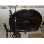 A cast iron fire back bearing date 1571, together with fire basket,