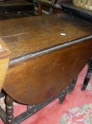 A circa 1700 and later oak oval gate-leg drop-leaf dining table on baluster turned and ringed