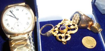 A 9 carat gold cased Rolco wristwatch with expanding bracelet, an 1850 $1 gold coin,