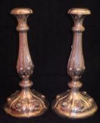 A pair of mid 19th Century Austro Hungerian silver candle sticks of balauster form with embossed