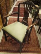 Two mahogany framed carver chairs in the Hepplewhite manner with green upholstered seats,