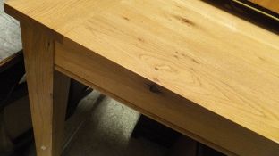 A late 20th Century rectangular oak dining table on square sectioned legs
