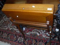 A circa 1900 oak travelling writing table, raised on X frame supports,