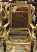 A pair of beech framed wing back armchair frames with mahogany turned and carved legs