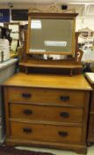 An Edwardian satin walnut dressing chest with mirror to the superstructure, above three drawers,