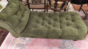 A Victorian day bed in green velvet self-patterned upholstery,