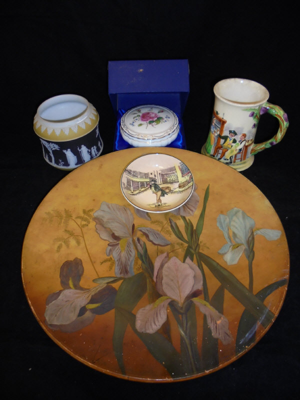 A Victorian hand-painted terracotta charger decorated with iris, signed "J Jellis 1889",