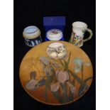 A Victorian hand-painted terracotta charger decorated with iris, signed "J Jellis 1889",