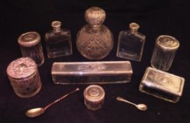 A collection of white metal mounted dressing table bottles,