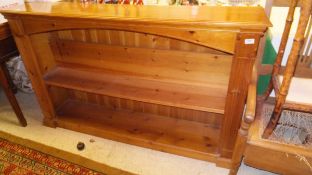 A pine open bookcase of three shelves, an octagonal topped bamboo framed two tier occasional table,