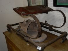 A Victorian sprung step with mahogany step on iron frame to wooden castors,
