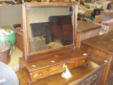 A Victorian mahogany and inlaid toilet mirror, the plain glass above a base of three drawers,