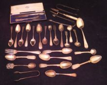 A box of assorted silver spoons, forks, sugar tongs, etc,