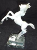 A 20th Century Istvan Komaromy lamp work figure of a rearing horse in opalescent white glass