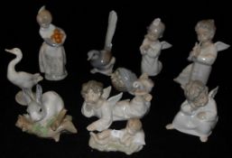 A selection of Lladro figurines to include girl carrying oranges, one figure playing violin,