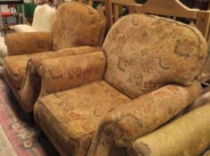 A pair of Derwent armchairs in foliate upholstery,