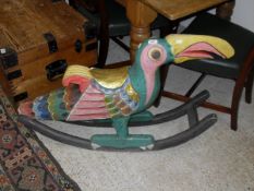 A child's rocker in the form of a toucan,